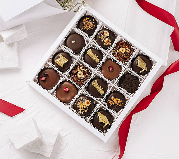 istock Elegant box of assorted chocolates with delicate decorations and ribbon 2229853810