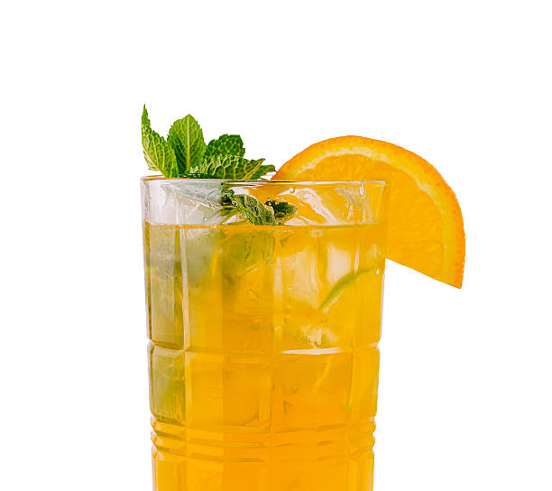 istock Refreshing citrus cocktail with mint and orange garnish in clear glass 2229854733