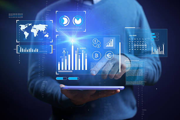 istock Business professional analyzing data trends on tablet with digital graphs and charts in modern workspace 2229856573