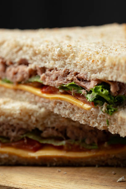 istock Savory tuna sandwich with fresh lettuce and cheese on whole grain bread served for lunch 2229856614