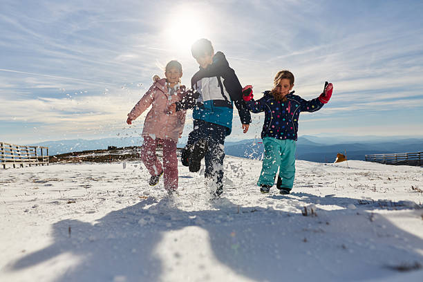 istock Happy kids enjoying winter snow 2229857715
