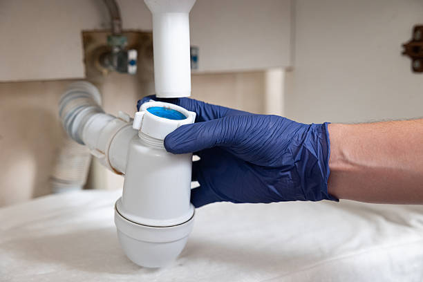 istock A man's hands clean the sink siphon from dirt. 2229858143