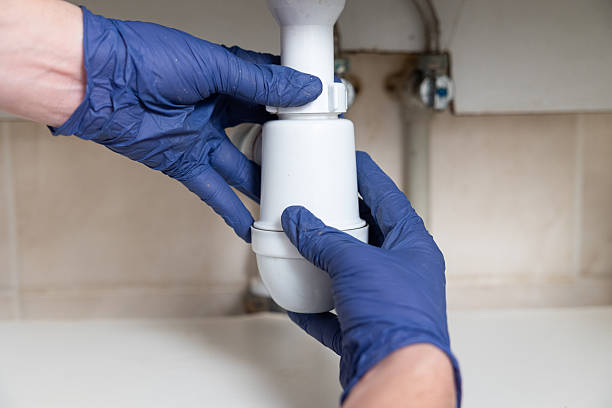 istock A man's hands clean the sink siphon from dirt. 2229858167