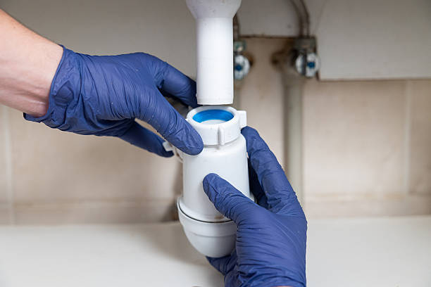 istock A man's hands clean the sink siphon from dirt. 2229858168