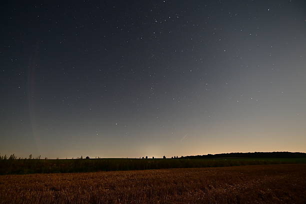 istock Night Starry Sky Over the Field with Perseid Meteor Shower 2229860013