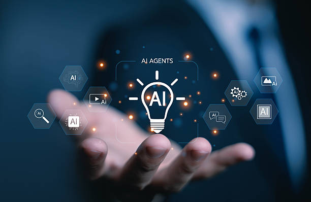 istock Hand holding AI agents lightbulb hologram with digital icons, representing artificial intelligence innovation, smart technology, and creative solutions for business and automation. AI agents assistant 2229860843