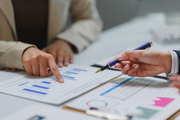 istock Businesswomen analyzing financial charts and data at office meeting 2229863569