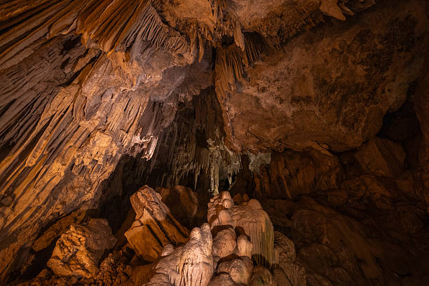 istock Unique rock formations create a mesmerizing underground landscape filled with stalactites and stalagmites, illuminated by soft lighting that highlights their natural beauty 2229864115