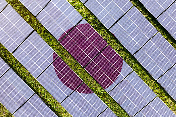 istock Solar farm superimposed with flag of Japan. Symbolizing solar power and panel demand, renewable energy industry, government policy, and sustainability initiatives in the country. 2229865910