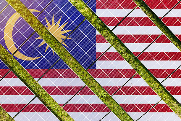 istock Solar farm superimposed with flag of Malaysia. Symbolizing solar power and panel demand, renewable energy industry, government policy, and sustainability initiatives in the country. 2229865932