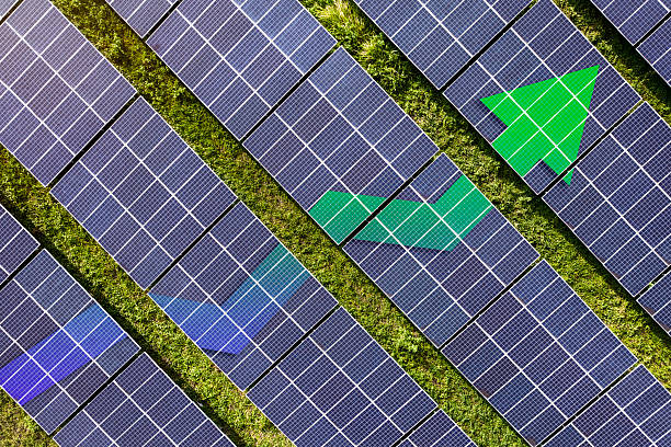 istock Upward line graph with arrow superimposed on rows of solar panel. Representing growth in production, efficiency and usage. Increasing demand of renewable energy usage. 2229867434