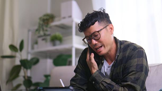 istock Business Communication – Asian Man Video Conferencing on Tablet and laptop. 2229870713