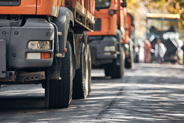 istock Public city street reconstruction with heavy machines. 2229873025