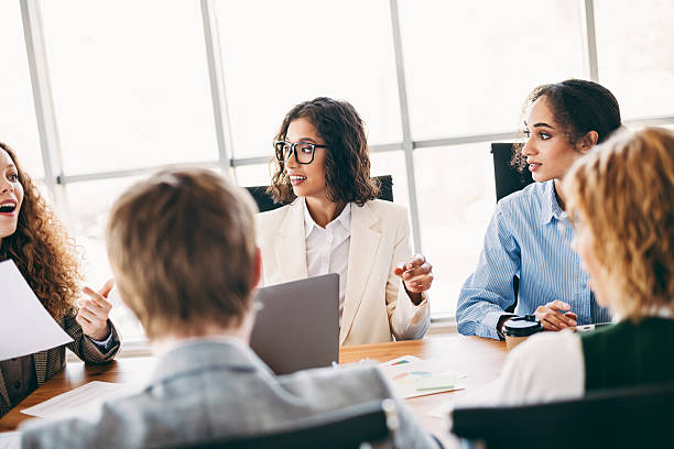 istock Professional team discussing strategies in a modern office setting during a collaborative meeting, fostering teamwork and innovation. 2229875315
