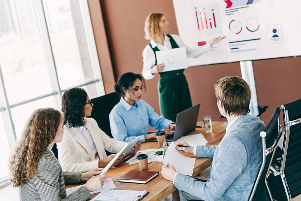istock Group of diverse business professionals collaborating on a project during a meeting in a modern office environment 2229875323