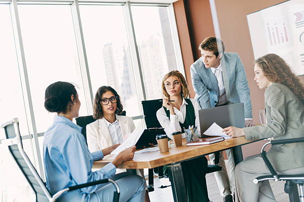istock Professional team members discussing a business project during a meeting in a modern office space 2229875381