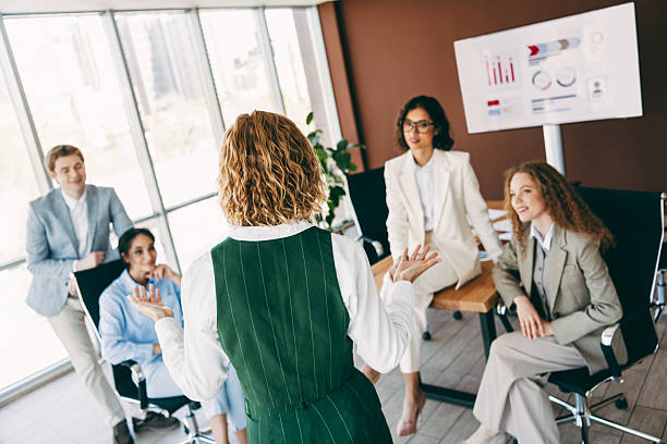 istock Professional team engaged in a business discussion in a modern office setting, emphasizing collaboration 2229875395