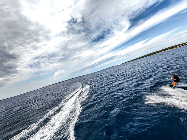 istock High-Speed Wakeboarding on Open Water, Aerial Drone View with Cloudy Skies 2229875865