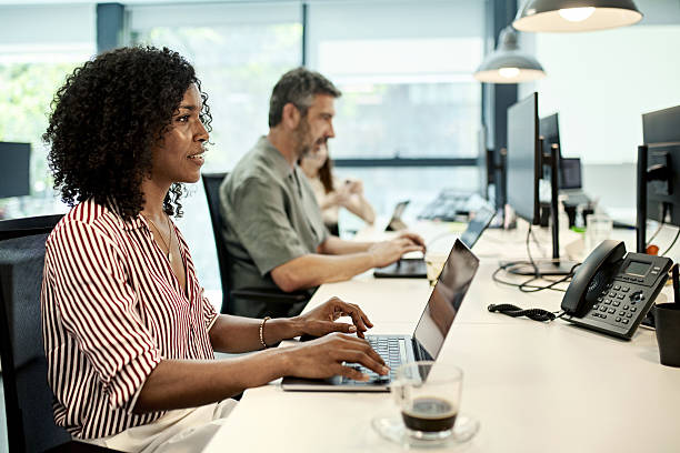 istock Afro-Caribbean businesswoman back to work in modern office 2229878155