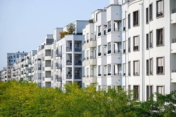 istock Row of white townhouses 2229881374