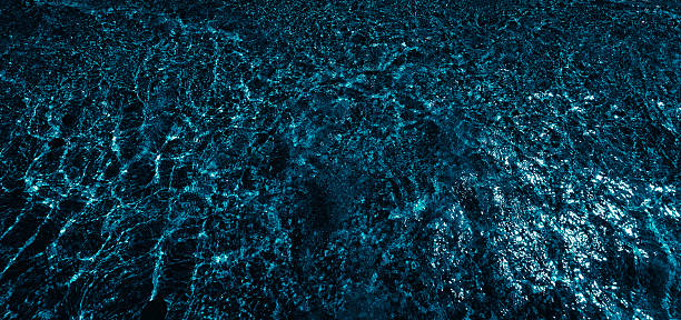 istock dark blue sea water, close up 2229881870