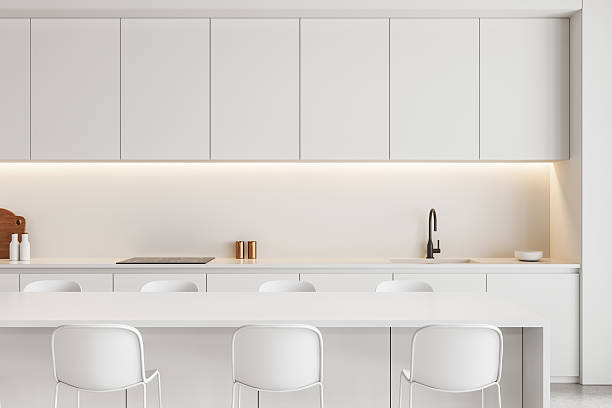 istock Modern minimalist white kitchen interior with clean lines, integrated lighting, and sleek cabinetry in neutral tones. 3D Rendering 2229882140