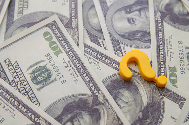 istock Yellow Question Mark on Hundred-Dollar Bills  Symbolizing Financial Uncertainty and Decision-Making Challenges 2229892037