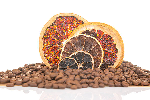 istock Dried citrus slices and coffee beans create a unique display on a white background 2229894406