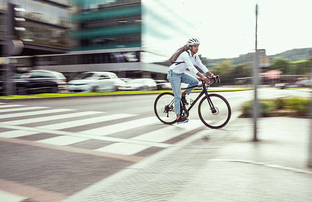 istock Young Multiracial Female Commuting on Bicycle in Urban Area 2229896990