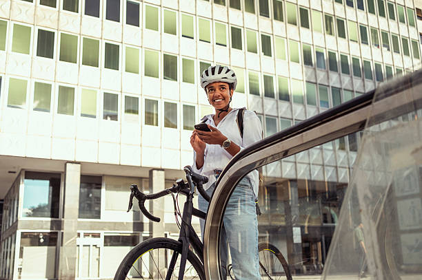 istock Young Caucasian Female Commuting With Bicycle Using Smartphone 2229897036