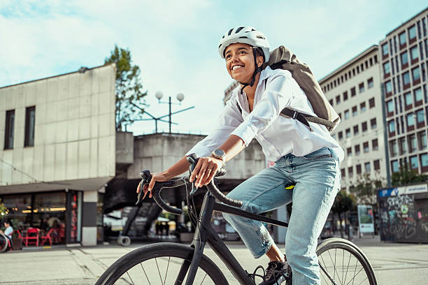 istock Young Multiracial Female Commuting by Bicycle in Business District 2229897047