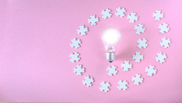istock Business concept,collaboration,cooperation,teamwork makes the dream work,idea,communication, innovation,human resources,recruitment,team building. Jigsaw puzzle pieces and light bulb. 2229901289
