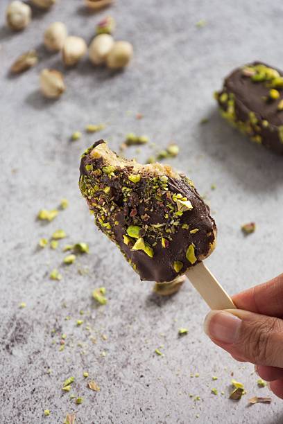 Chocolate ice cream bar with pistachios