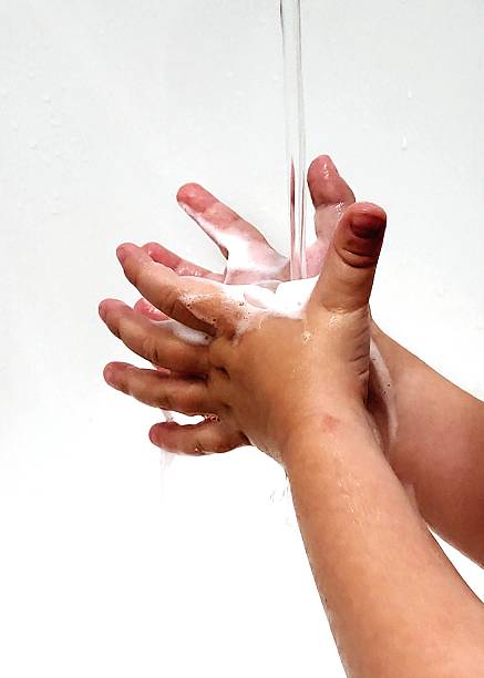 istock Childhood Hygiene: A Child Washing Hands with Soap 2229902492