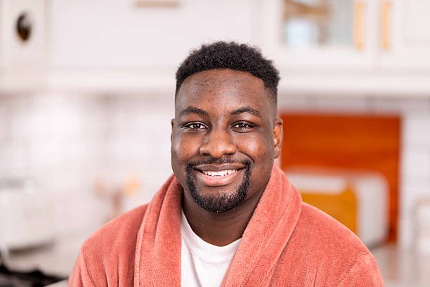 istock Smiling Man Relaxing in Comfortable Bathrobe at Home 2229903347