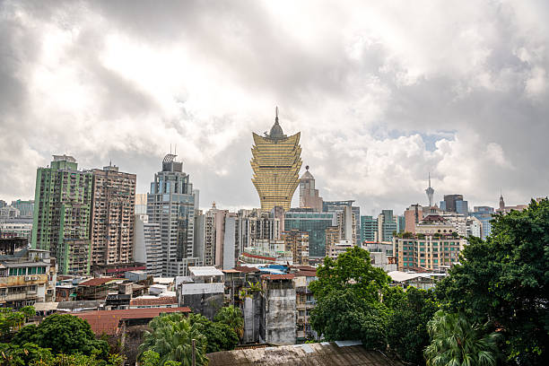 istock Panoramic view from Monte Fort in Macau, showcasing historic stone walls, lush greenery, and iconic Grand Lisboa 2229904690