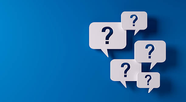 istock Question mark speech bubbles in front of a blue wall 2229905006