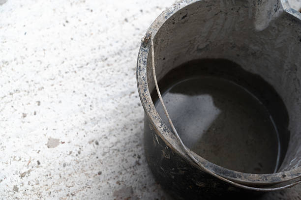 istock A CloseUp View of a Bucket Holding Water on a Rough Concrete Surface Beneath It 2229909497