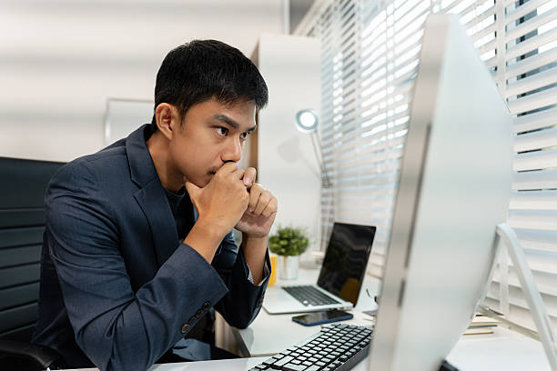 istock stressed asian businessman working in the office. 2229911519