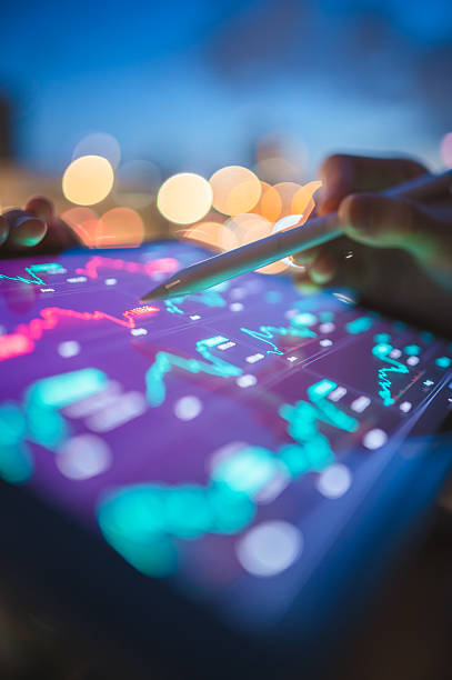 istock digital trader analyzing financial trends with holographic charts interactive screen with crypto and stock data visualizations in colorful ai-powered trading dashboard 2026 2229916823
