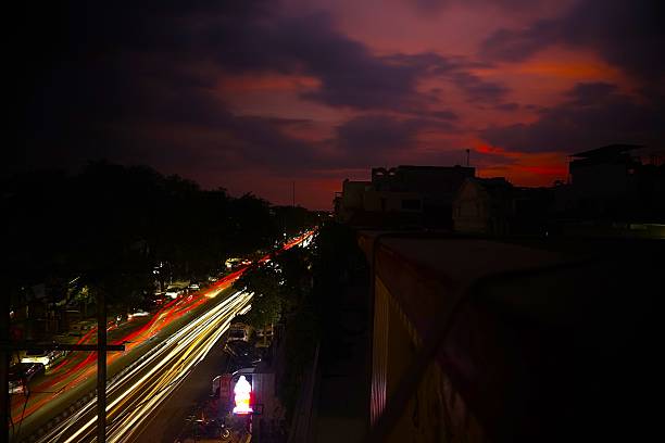 istock Light trails on city road captured from above 2229917925