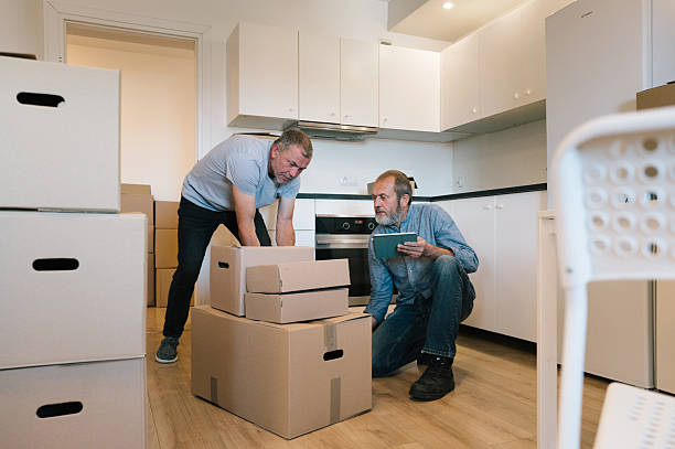 istock An older man use a touchpad for inventory management while relocation into new apartment 2229920878