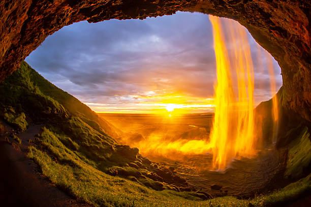 istock Majestic sunset behind Seljalandsfoss waterfall in Iceland creates a golden glow 2229921449