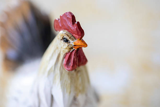 Extreme close-up of a wooden chicken ornament