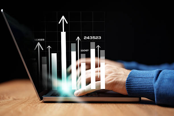istock Data analysis and business growth tracking happening on a laptop computer at a modern workspace 2229925609