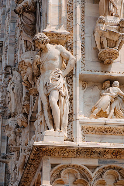 istock a figure leans on Milans Cathedral corner 2229925777