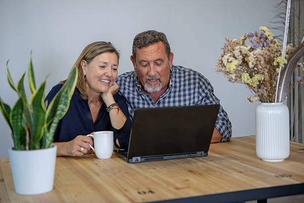 istock Senior couple using the computer at home 2229927915