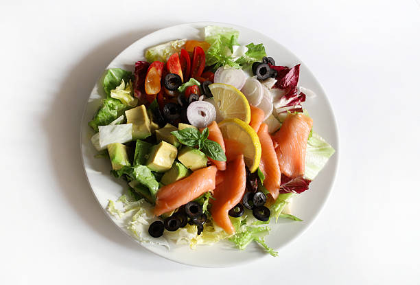 Prawn & smoked salmon salad with lettuce, cherry tomatoes, avocado, radish, boiled eggs and Marie-rose sauce,
