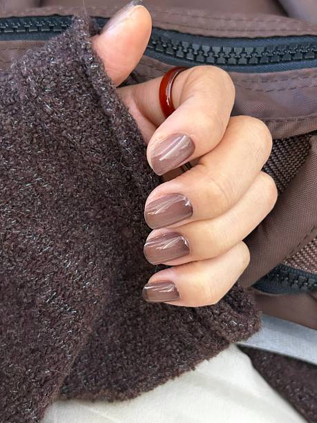 istock Creative nail art featuring intricate designs, vibrant colors, and unique patterns. Perfect for beauty and fashion photography, showcasing trends in nail designs and the artistry of manicure. 2229928988