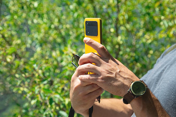 istock Man taking picture in nature by smartphone. 2229930048